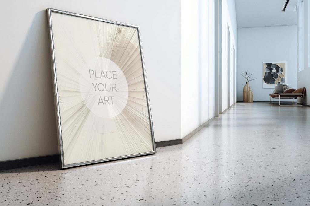 Vertical chrome wall art frame mockup with a strong retro vibe, leaning on a polished terrazzo floor in a bright Atomic Era inspired gallery hallway.