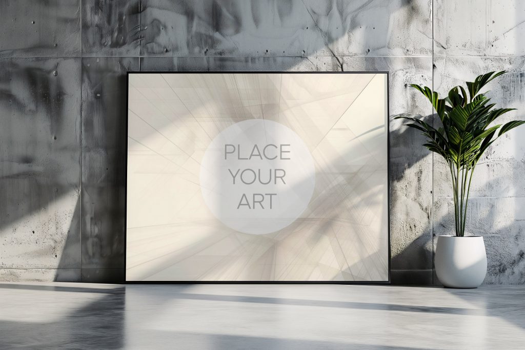 Large landscape frame mockup leaning on a polished cement floor next to a white spherical ceramic pot with a green plant against a raw industrial concrete wall.