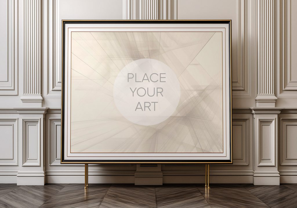 Large horizontal black and gold frame mockup standing on slim brass legs against a white neoclassical wall with fluted panels and a dark herringbone floor.