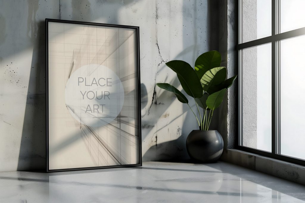 Large vertical wall art mockup leaning on a glossy polished concrete floor in a room corner, next to a black spherical planter with a lush green plant by a large black-framed industrial window.