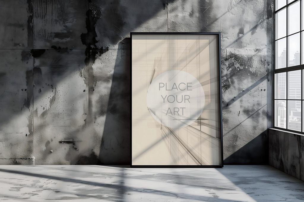 Large vertical wall art mockup leaning on a concrete floor in a raw brutalist loft with a high-contrast weathered cement wall and a large window overlooking a city skyline under sharp sunlight shadows.