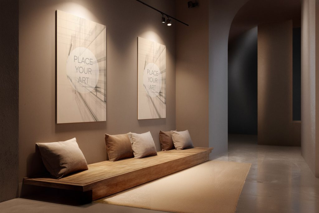 japandi-gallery-mockup-dual-canvas-warm-spotlights-lounge.jpg Two large vertical canvas mockups on a warm grey wall illuminated by ceiling spotlights above a wooden bench with cushions in a minimalist hallway.