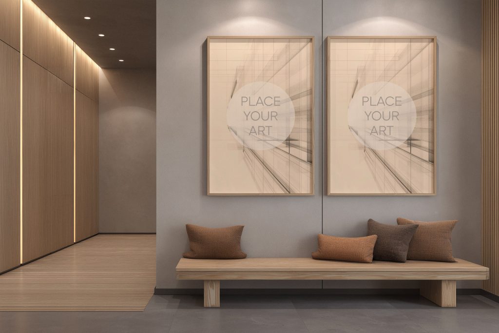 japandi-interior-mockup-double-vertical-frames-wood-bench-spotlights.jpg Two vertical wooden frame mockups side by side on a grey wall above a minimalist wooden bench with brown cushions and warm spotlighting.