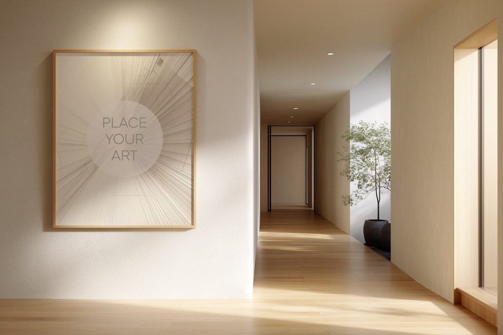Vertical oak wood frame mockup on a textured white wall in a modern Japandi hallway with light wood floors, a potted plant, and soft natural sunlight.